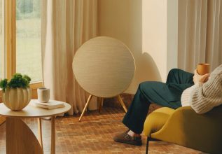 A Bang & Olufsen speaker in a warm living room