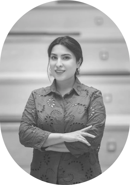 Portrait of Maryam Maralani, smiling with her arms crossed